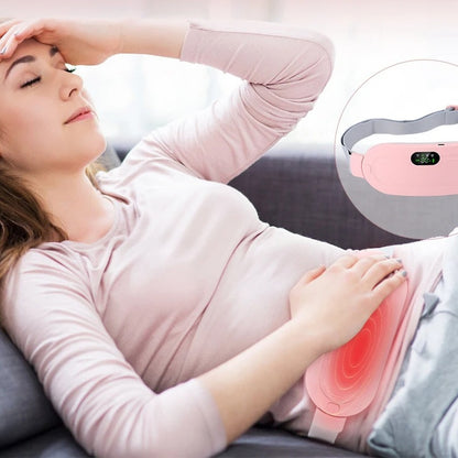 Woman resting on a sofa with the WarmCore Pro belt warming her lower belly